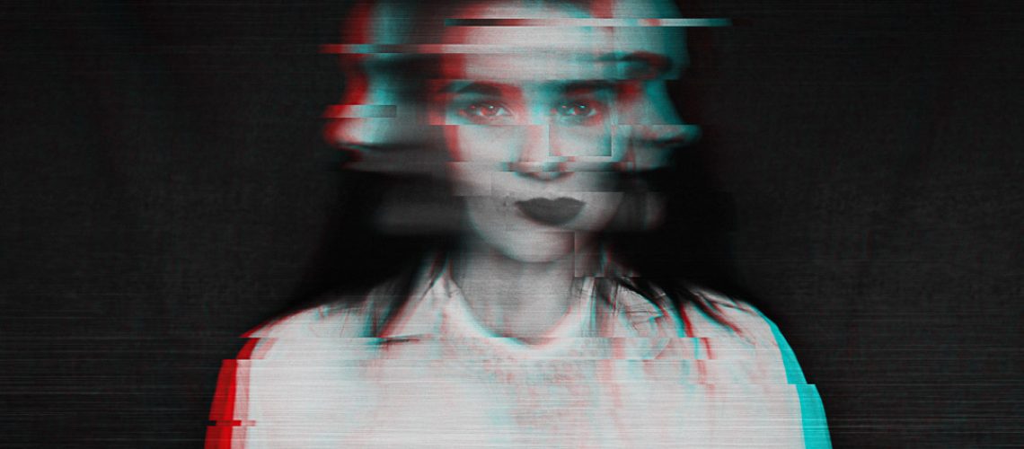 black and white blurred abstract portrait of a girl with mental disorders and schizophrenia with a glitch effect of virtual reality